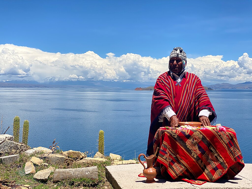 Aymara man and Lake Titicaca