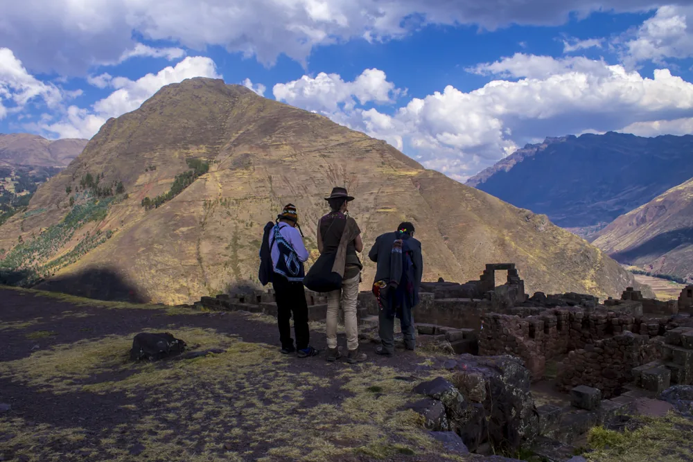 Peru Wayna Picchu guide with travelers at an Inca site near Cusco